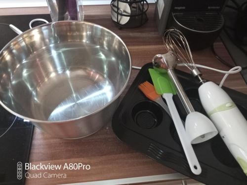 a whisk and a bowl on top of a counter at Um Burebierg apartment 35m2 in Buschrodt