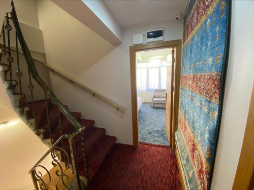 a hallway with a staircase and a stairway leading to a room at Turk Art Hotel in Istanbul
