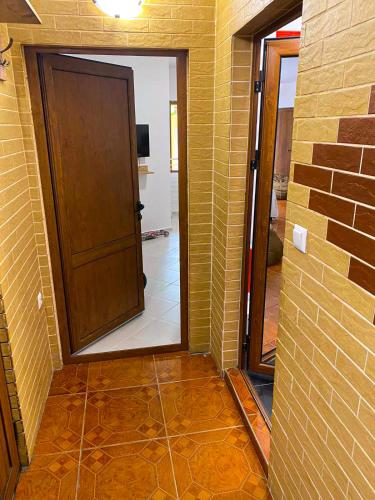 a hallway with a door and a mirror in a room at Casa Beach in Ravda