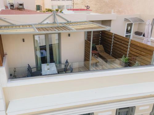 an external view of a house with a balcony at Philia Boutique Hotel in Athens