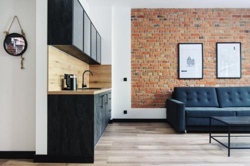 Manpro Apartments Toruńにあるキッチンまたは簡易キッチン
