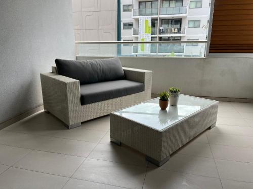 a living room with a chair and a coffee table at 2 On Trend Condo Near Crown 1br in Perth