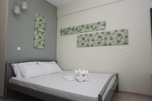 Postel nebo postele na pokoji v ubytování Kasimidis Apartments
