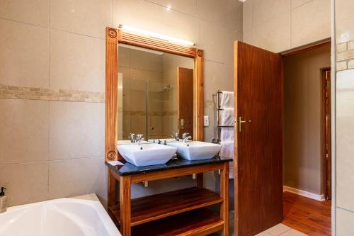 Katil atau katil-katil dalam bilik di Mooiplaas Guesthouse