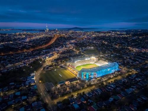 an aerial view of a soccer stadium at night at Home on The Grange in Mt Eden in Auckland