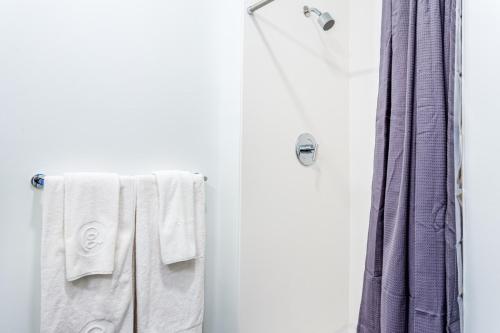 a bathroom with white towels and a shower at Central Sq Studio w Doorman nr Charles River BOS-312 in Cambridge