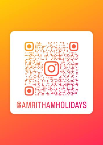 Amritham Holidays Homestay Trivandrumに飾ってある許可証、賞状、看板またはその他の書類