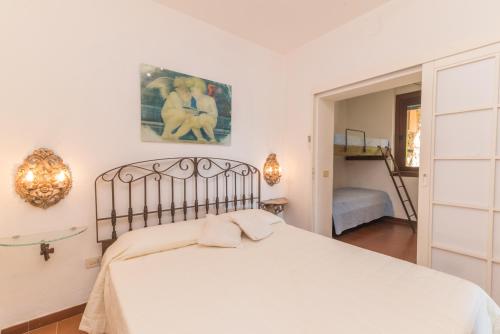 Postel nebo postele na pokoji v ubytování Appartamento Z2 20 Cala Capra