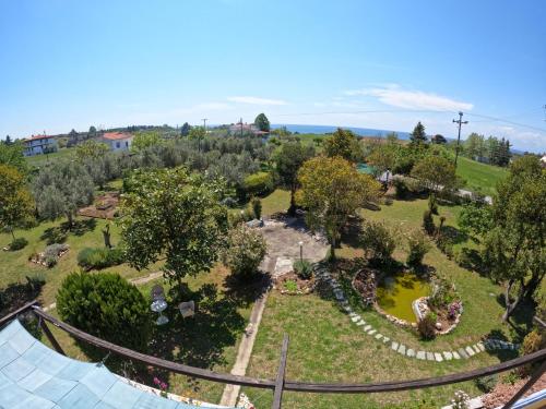 an aerial view of a park with trees and flowers at Nice house by the sea! in Epanomi