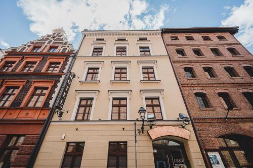 a group of buildings in a city at Hotel Solaris in Toruń