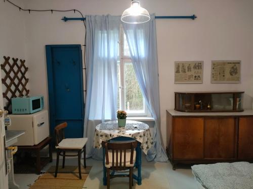 a kitchen with a table and a window at Willa Gaszek in Inowłódz