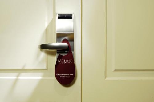 a close up of a door with a brush at MIL810 Ushuaia Hotel in Ushuaia