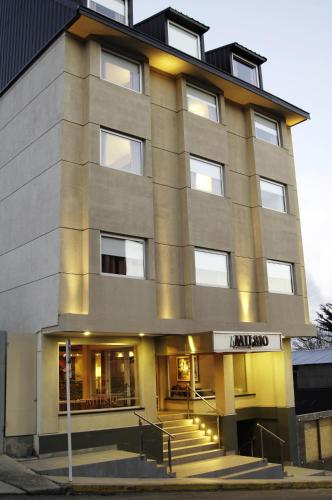 a tall building with stairs in front of it at MIL810 Ushuaia Hotel in Ushuaia
