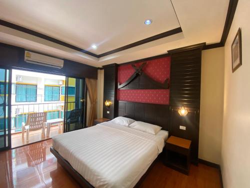 Cama o camas de una habitación en Nanai 2 Residence Patong Phuket