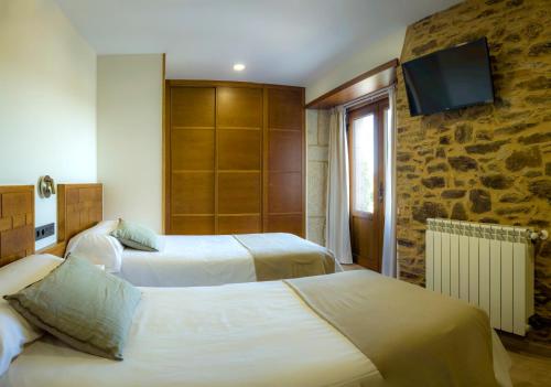 Postelja oz. postelje v sobi nastanitve Casa Rural Camino Real Completa
