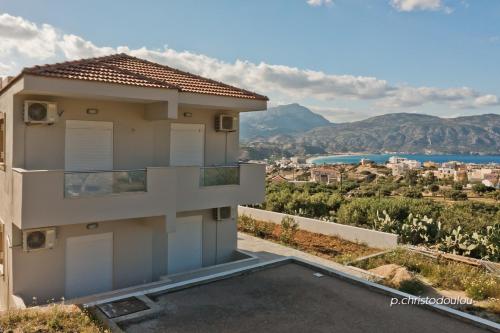 a villa with a view of the mountains at Karpathos City View Apartments in Karpathos