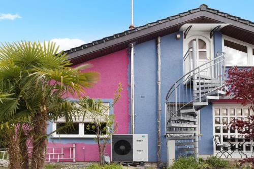a colorful house with a staircase on the side of it at Haus Schwanenweg in Konstanz