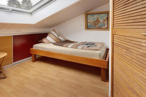 a bedroom with a bed in a attic at Haus Schwanenweg in Konstanz