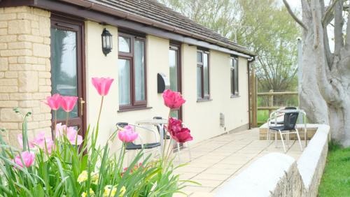 a house with pink flowers in front of it at The Old Rectory - Brean in Brean