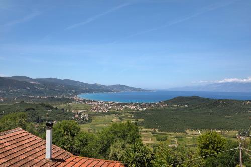 a view of the ocean from the roof of a house at Zante Sunset Vibes Luxury Villa in Áno Yerakaríon