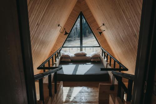 a room with a bed in the middle of a building at Haita Land in Vatra Dornei