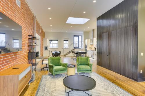an office with green chairs and a table at Downtown Omaha Getaway with Deck and Gas Grill! in Omaha