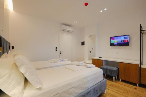 Postel nebo postele na pokoji v ubytování HOTEL RENATO