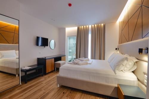 Postel nebo postele na pokoji v ubytování HOTEL RENATO