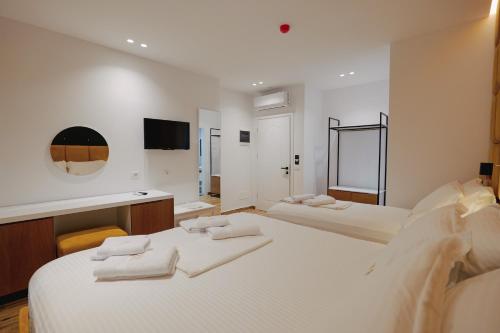 Postel nebo postele na pokoji v ubytování HOTEL RENATO