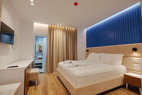 Postel nebo postele na pokoji v ubytování HOTEL RENATO