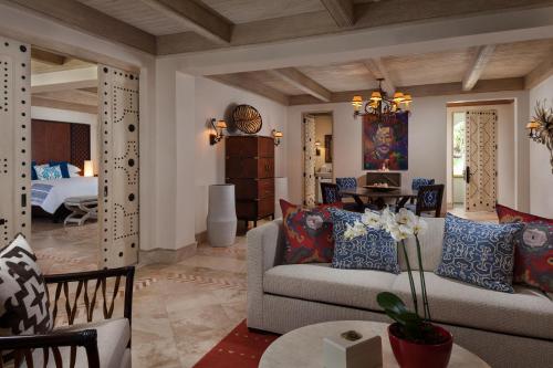 a living room with a couch and a table at One&Only Palmilla in San José del Cabo
