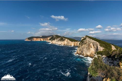 an aerial view of the ocean with cliffs at Sunny Room Lefkada in Lygia