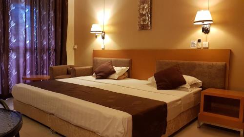 Katil atau katil-katil dalam bilik di Monalysa St Honore Apartment & Studios Grand Bay