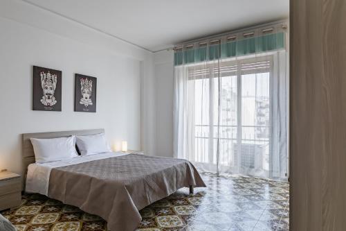 Katil atau katil-katil dalam bilik di Via Libertà Roomy Apartment