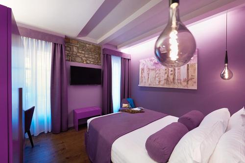 Letto o letti in una camera di 73 Boutique Hotel