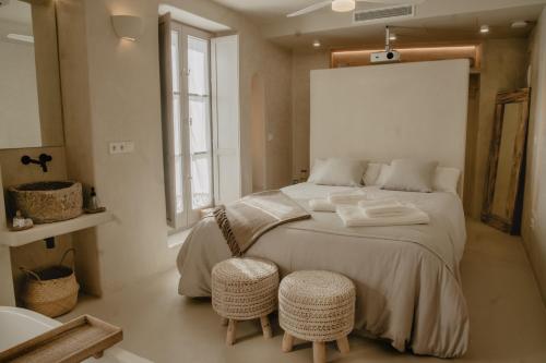 Postel nebo postele na pokoji v ubytování EntreArcos Casa Eco-Boutique