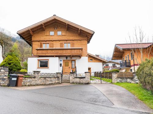 a large wooden house with a driveway at Holiday Home Haus Weickl by Interhome in Kaprun
