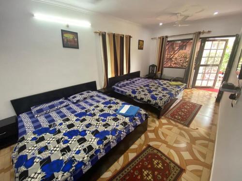 Postel nebo postele na pokoji v ubytování Sunrest Villa