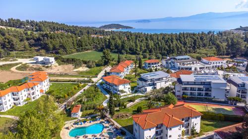 an aerial view of a resort with a swimming pool at Chrousso Village in Paliouri