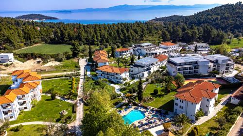an aerial view of a resort with a swimming pool at Chrousso Village in Paliouri