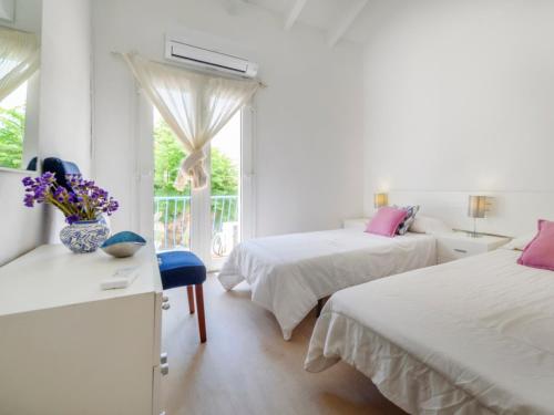 Ένα ή περισσότερα κρεβάτια σε δωμάτιο στο Villa Nacho