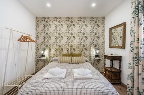 Un pat sau paturi într-o cameră la Higuera's Home