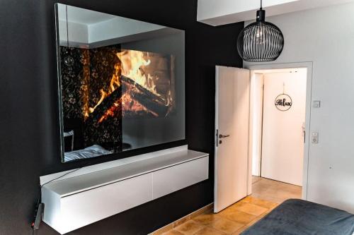 Televisyen dan/atau pusat hiburan di Moderne Wohnung im Herzen Offenbachs