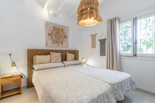 Postel nebo postele na pokoji v ubytování Verano Eterno