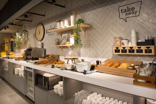 a bakery with a counter with pastries on it at voco Bilbao - City by IHG in Bilbao