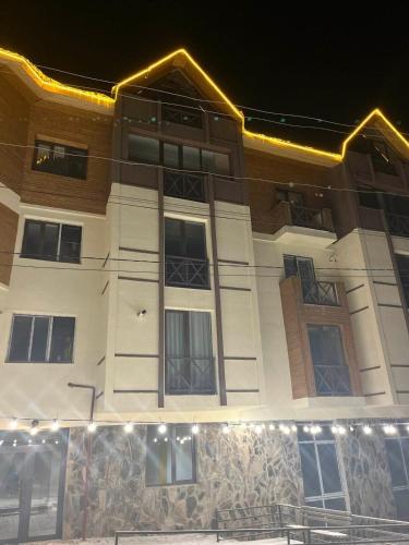 a building with lights on the side of it at Bakuriani MIX 401G in Bakuriani