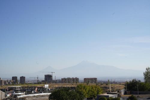 a view of the city from the roof of a building at Cross Resort Hotel in Yerevan