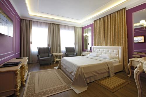 Кровать или кровати в номере Отель Таёжный