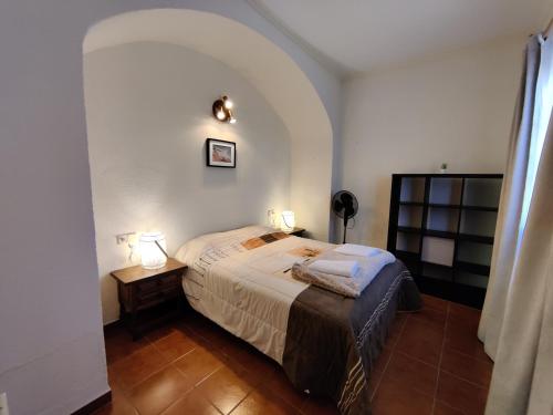 Posteľ alebo postele v izbe v ubytovaní Calonge's Hideout
