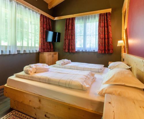 Letto o letti in una camera di Hotel Somont